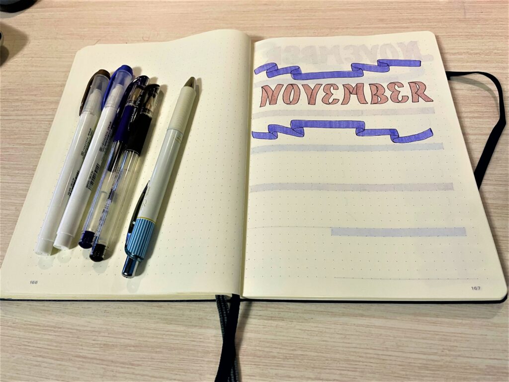 Bujo November cover page with ribbons