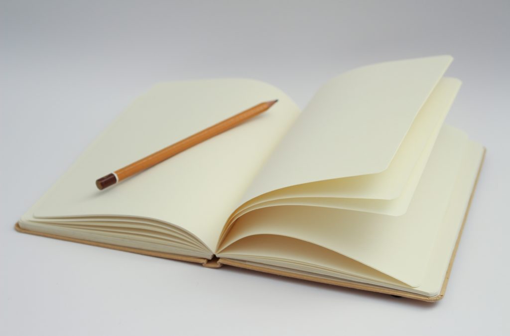 Empty notebook and pencil