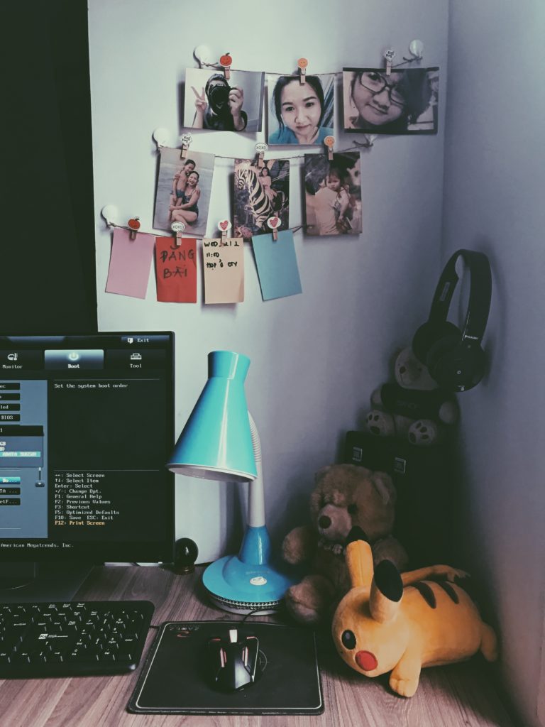 Desk with plushies and photos